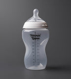 Tommee Tippee baby bottle on a dark gray background